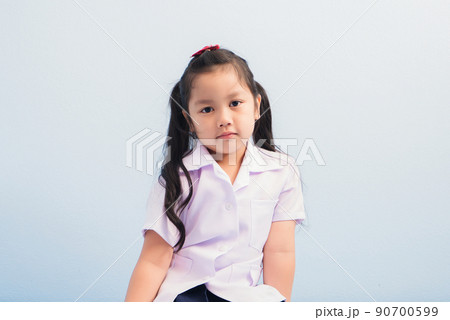 Happy cute girls in white medical uniform and stethoscope act like doctor. child dreams of becoming a doctor career concept 90700599