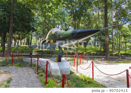 Ho Chi Minh, Vietnam - Oct 17, 2019 : Northrop F-5E Tiger fighter jet of the South Vietnamese Army displayed outside of the Reunification Palace in Ho Chi Minh City, Vietnam on Oct 17, 2019. Ho Chi Minh, Vietnam - Oct 17, 2019 : Northrop F-5E Tiger fighter jet of the South Vietnamese Army displayed outside of the Reunification Palace in Ho Chi Minh City, Vietnam on Oct 17, 2019. 90702413
