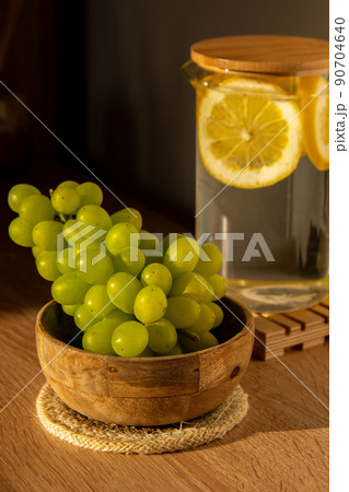 Green Grapes lie on eco dish. Eco-friendly choice and friendly nature. The concept of world without plastic free and clean planet 90704640