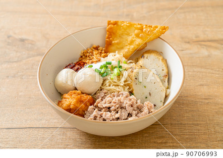 spicy egg noodles with fish balls and shrimp balls without soup spicy egg noodles with fish balls and shrimp balls without soup 90706993