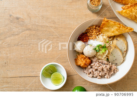 spicy egg noodles with fish balls and shrimp balls without soup spicy egg noodles with fish balls and shrimp balls without soup 90706995