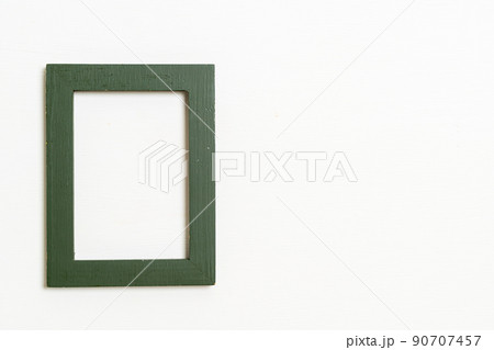 empty picture frame on white wall background 90707457