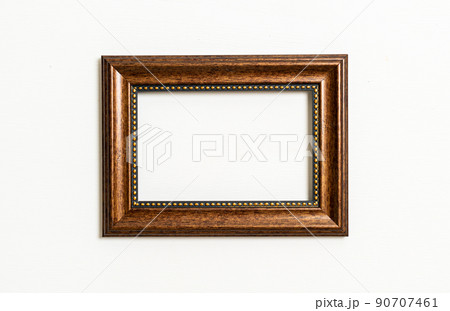 empty picture frame on white wall background 90707461