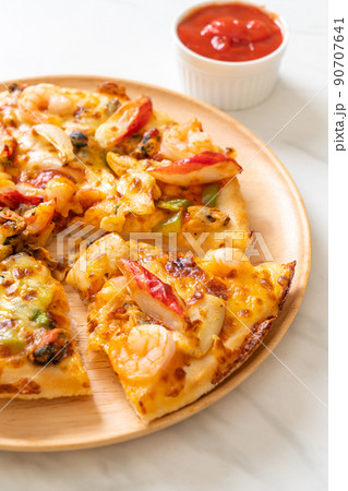seafood pizza on wood tray 90707641