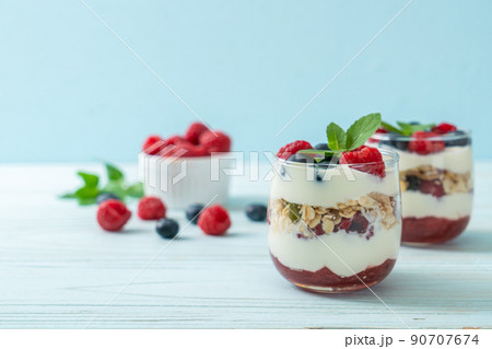 homemade raspberry and blueberry with yogurt and granola homemade raspberry and blueberry with yogurt and granola 90707674