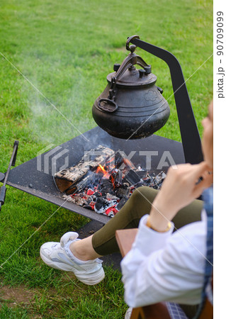 Cast iron pot over the fire Cast iron pot over the fire 90709099