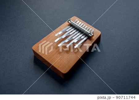Traditional wooden kalimba isolated on black Traditional wooden kalimba isolated on black 90711744