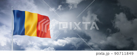 Romanian flag on a cloudy sky 90711849