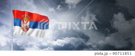 Serbian flag on a cloudy sky 90711851