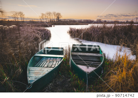 Two boats on the shore of the lake Two boats on the shore of the lake 90714742