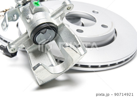 brand new brake caliper and brake discs set for car. isolated on white. brand new brake caliper and brake discs set for car. isolated on white. 90714921