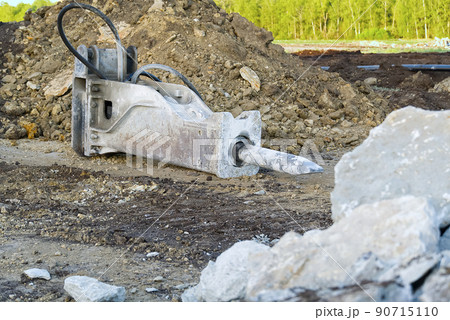 Excavator demolition hammer. excavator hydraulic hammer. hydraulic Jack Hammer used for heavy duty demolition. selective focus. 90715110