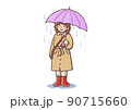 大雨の日に重装備で外出する若い女性 90715660