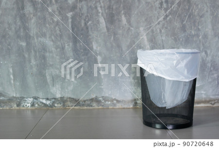 cement background with a bin 90720648