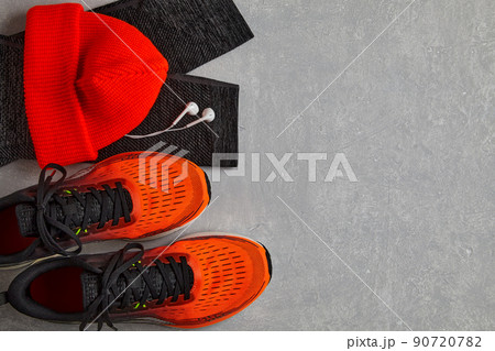 Orange running sneakers, orange knitted hat, warm leggings for sports Orange running sneakers, orange knitted hat, warm leggings for sports 90720782