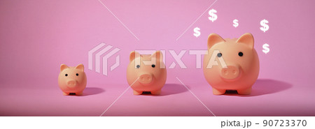 Piggy bank isolated on pink background. Saving money concept. 90723370