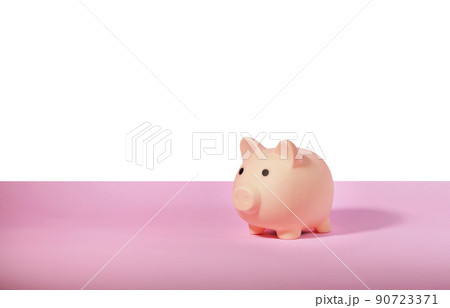 Piggy bank isolated on pink background. Saving money concept. Piggy bank isolated on pink background. Saving money concept. 90723371