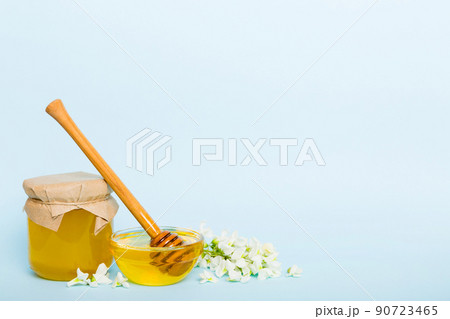 robinia honey bollte with acacia blossoms on colored table robinia honey bollte with acacia blossoms on colored table 90723465