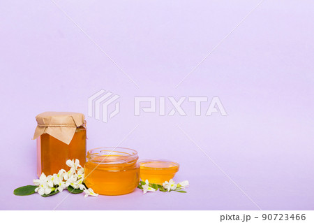 robinia honey bollte with acacia blossoms on colored table robinia honey bollte with acacia blossoms on colored table 90723466
