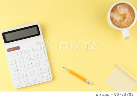 Office desktop concept on yellow background Office desktop concept on yellow background 90723705