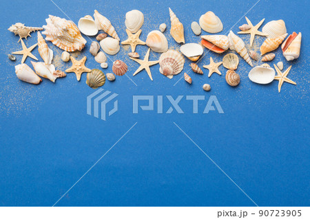 Summer time concept Flat lay composition with beautiful starfish and sea shells on colored table, top view with copy space for text 90723905