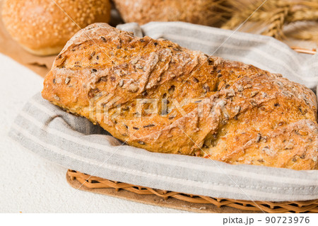 Homemade natural breads. Different kinds of fresh bread as background, perspective view with copy space Homemade natural breads. Different kinds of fresh bread as background, perspective view with copy space 90723976
