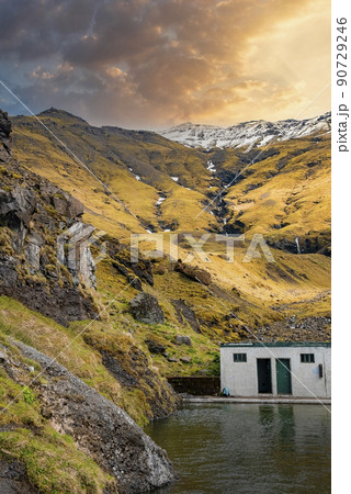 Idyllic view of Seljavallalaug hotspring pool against mountains during sunset Idyllic view of Seljavallalaug hotspring pool against mountains during sunset 90729246