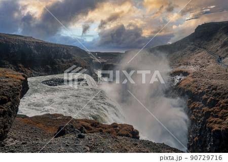 Beautiful foggy cascades of Gullfoss waterfall in Golden Circle during sunset 90729716