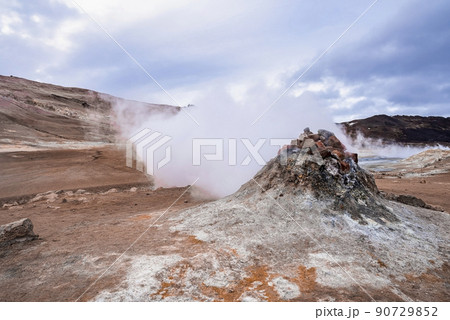 View of steam emitting from fumarole in geothermal area of Hverir at Namafjall View of steam emitting from fumarole in geothermal area of Hverir at Namafjall 90729852