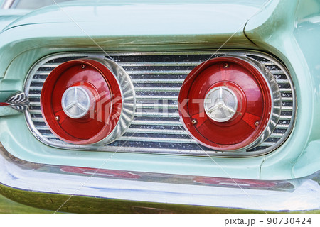 Retro car detail, Red rear light of old vintage american car Retro car detail, Red rear light of old vintage american car 90730424