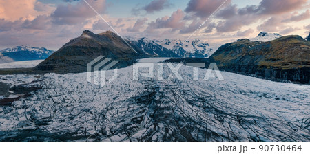 Beautiful glaciers flow through the mountains in Iceland. Beautiful glaciers flow through the mountains in Iceland. 90730464