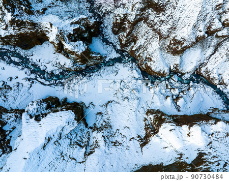 Aerial view of the glaciers and snowy mountains in Iceland. 90730484