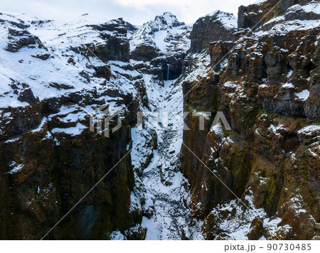 Aerial view of the glaciers and snowy mountains in Iceland. 90730485