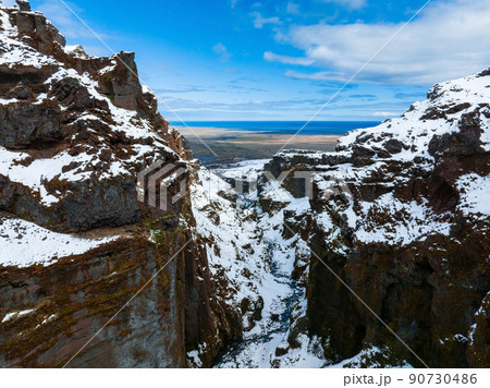 Aerial view of the glaciers and snowy mountains in Iceland. Aerial view of the glaciers and snowy mountains in Iceland. 90730486
