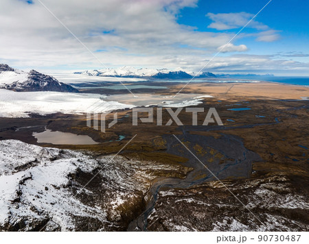 Aerial view of the glaciers and snowy mountains in Iceland. 90730487