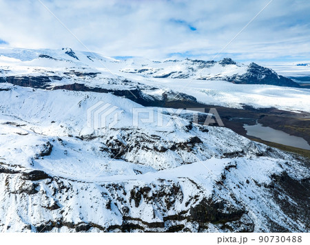 Aerial view of the glaciers and snowy mountains in Iceland. Aerial view of the glaciers and snowy mountains in Iceland. 90730488