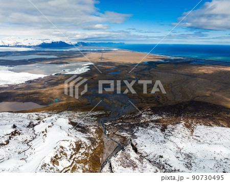 Aerial view of the glaciers and snowy mountains in Iceland. 90730495