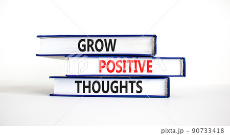 Grow positive thoughts symbol. Concept words Grow positive thoughts on books. Beautiful white table white background. Business grow positive thoughts concept. Copy space. 90733418