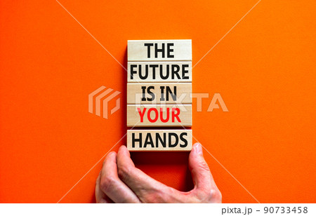 The future is in your hands symbol. Concept words The future is in your hands on wooden blocks on a beautiful orange table orange background. Businessman hand. Business future in your hands concept. The future is in your hands symbol. Concept words The future is in your hands on wooden blocks on a beautiful orange table orange background. Businessman hand. Business future in your hands concept. 90733458