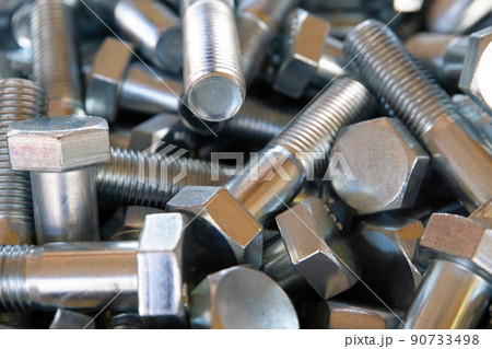 Close up of metall bolts background. Industrial abstract concept 90733498
