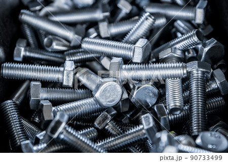 Close up of metall bolts background. Industrial abstract concept 90733499