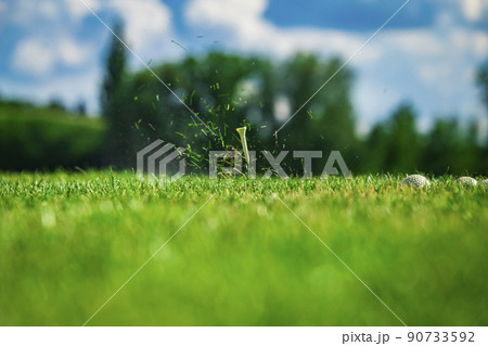 Playing golf. Golf course. Golf tee after shot. 90733592