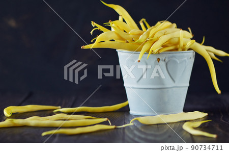 Fresh raw green asparagus on a wooden cutting board Fresh raw green asparagus on a wooden cutting board 90734711