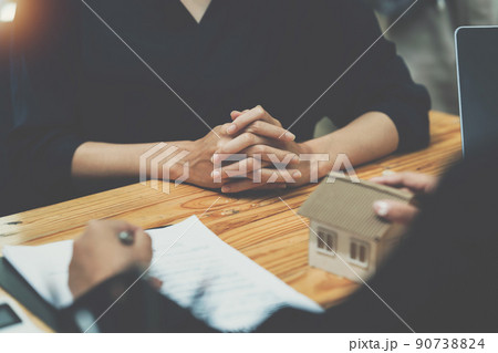 Real Estate Agent explain insurance and agreement contract to client before sign contract. Real Estate Agent explain insurance and agreement contract to client before sign contract. 90738824