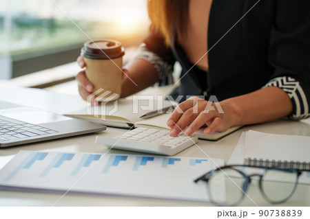 Portrait of Asian Business woman consult advice to customer about finance plan. Account concept. Portrait of Asian Business woman consult advice to customer about finance plan. Account concept. 90738839