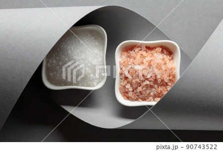 White ceramic bowls with pink and sea salt. 90743522