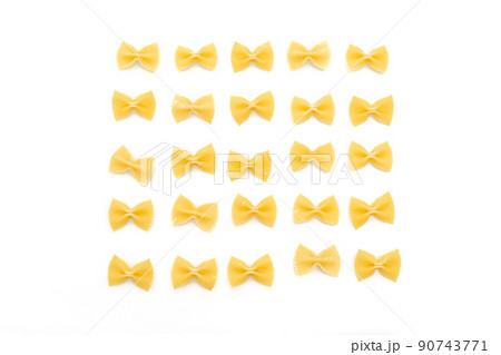 Dry uncooked farfalle pasta on white background Dry uncooked farfalle pasta on white background 90743771