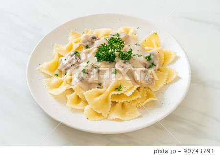 farfalle pasta with mushroom white cream sauce 90743791