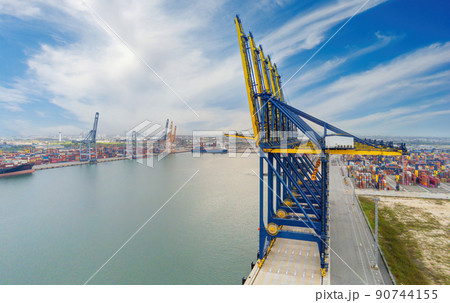 Cargo ship and truck at seaport waiting for container dock crane  shipment harbour loading container boxes import and export commercial trade business logistic and transportation of international. 90744155