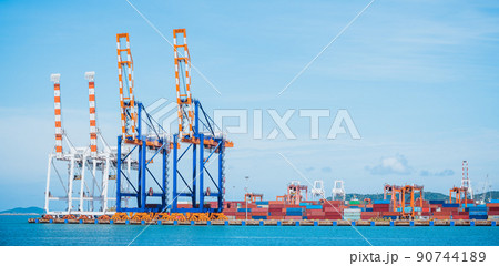Cargo ship and truck at seaport waiting for container dock crane shipment harbor loading container boxes import and export commercial trade business logistic and transportation of international. Cargo ship and truck at seaport waiting for container dock crane shipment harbor loading container boxes import and export commercial trade business logistic and transportation of international. 90744189